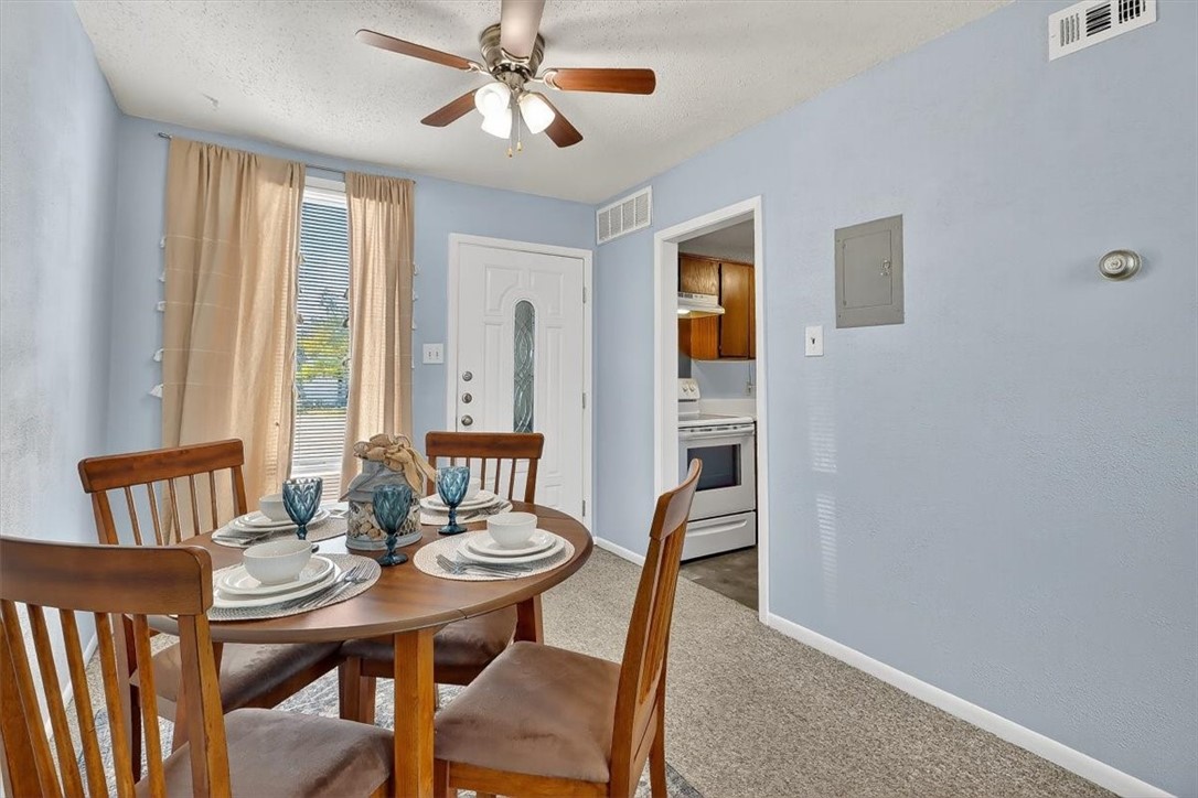 3402 Ocean Drive Corpus Christi, TX 78411 - Photo 8 of 39 a view of a dining room with furniture and window
