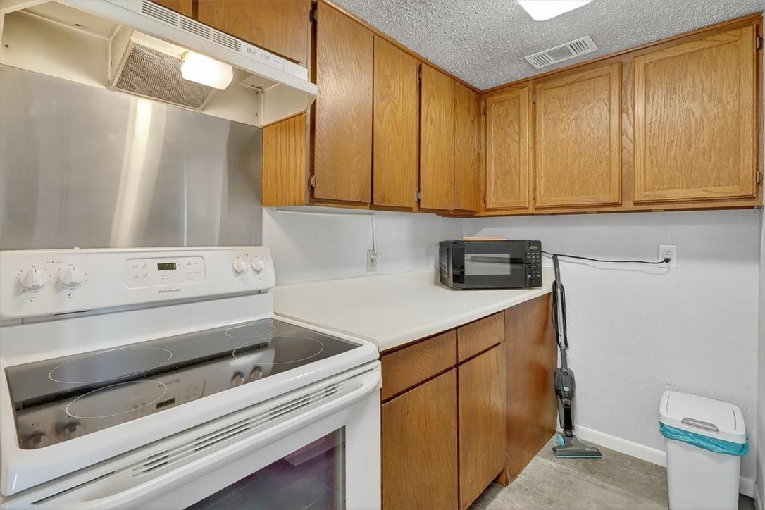3402 Ocean Drive Corpus Christi, TX 78411 - Photo 10 of 39 a kitchen with a sink and cabinets