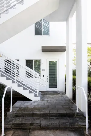 a view of an entryway with wooden floor