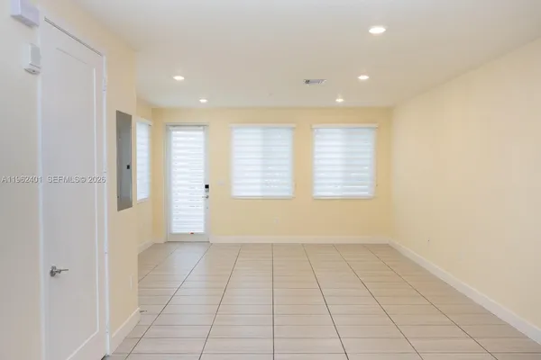 a view of an empty room with a window