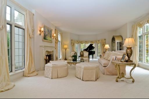 13 Riderwood Road North Barrington, IL 60010 - Photo 3 of 16 a living room with furniture a large window and a fireplace