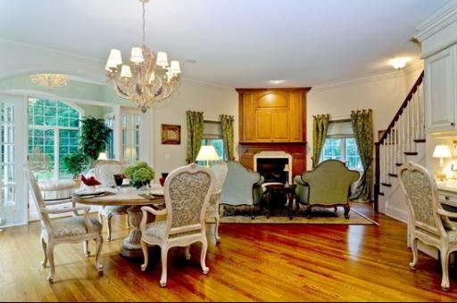 13 Riderwood Road North Barrington, IL 60010 - Photo 7 of 16 a view of a dining room with furniture a chandelier and wooden floor