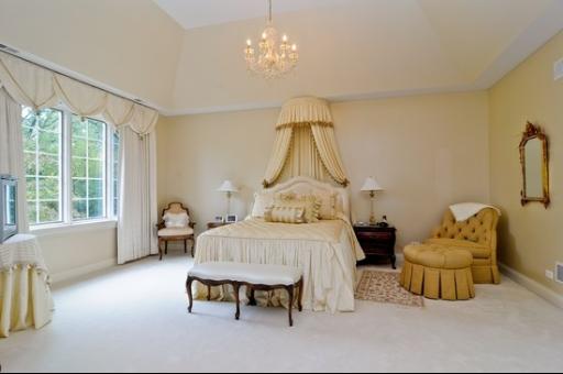 13 Riderwood Road North Barrington, IL 60010 - Photo 10 of 16 a bedroom with a bed and a chandelier