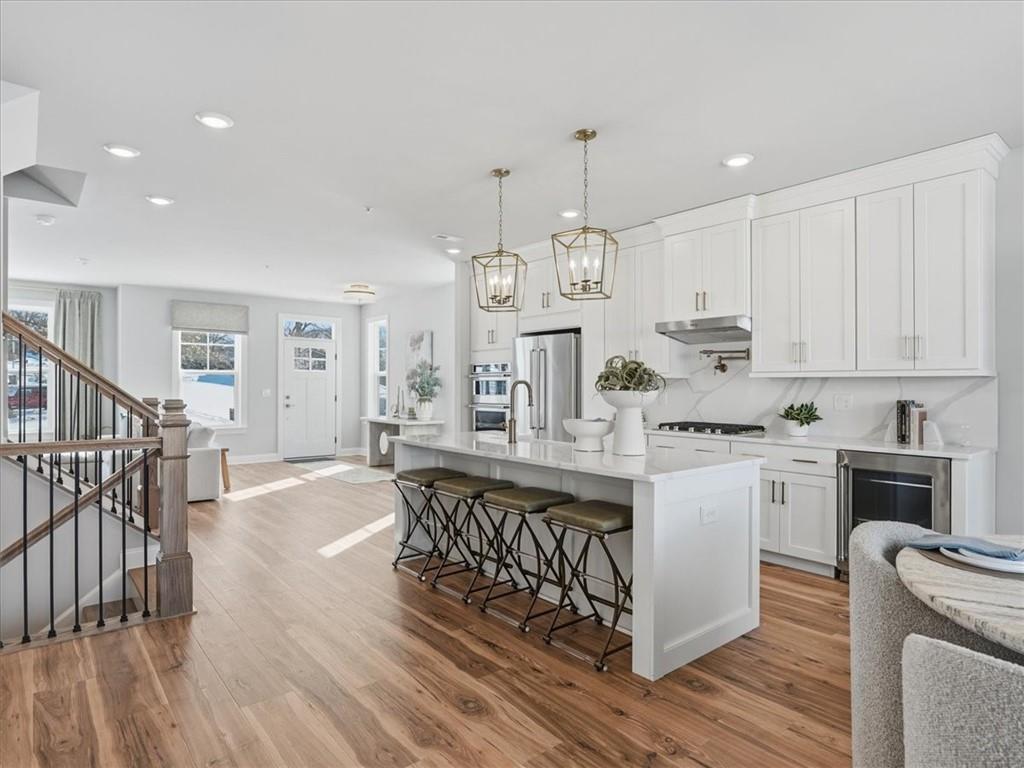 121 Quail Run Road Venetia, PA 15367 - Photo 3 of 24 Under cabinet lighting, timeless honey bronze finishes, and plenty of counterspace makes this kitchen perfect for everyday and entertaining