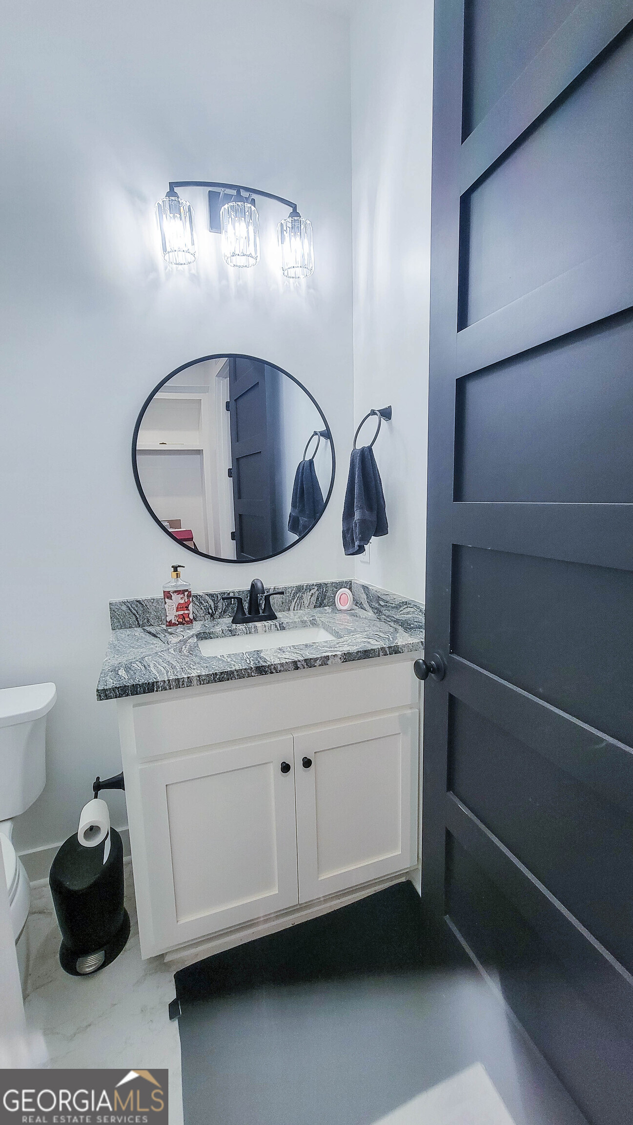 209 Lee Road Salem, AL 36874 - Photo 28 of 37 a bathroom with a sink and a mirror