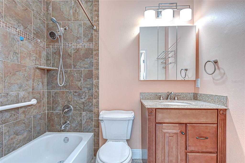 602 Fieldcrest Drive Brandon, FL 33511 - Photo 14 of 23 a bathroom with a sink toilet vanity and bathtub