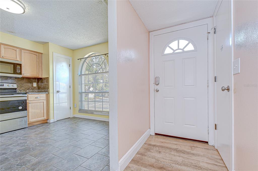 602 Fieldcrest Drive Brandon, FL 33511 - Photo 4 of 23 a view of an empty room with a kitchen