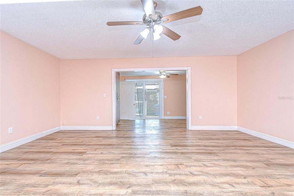 602 Fieldcrest Drive Brandon, FL 33511 - Photo 9 of 23 a view of an empty room with window and wooden floor