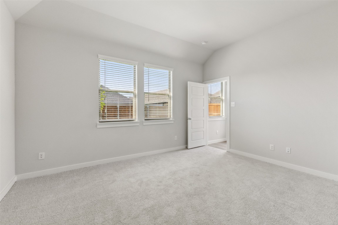 153 Tolo Drive Elgin, TX 78621 - Photo 11 of 25 a view of an empty room with a window