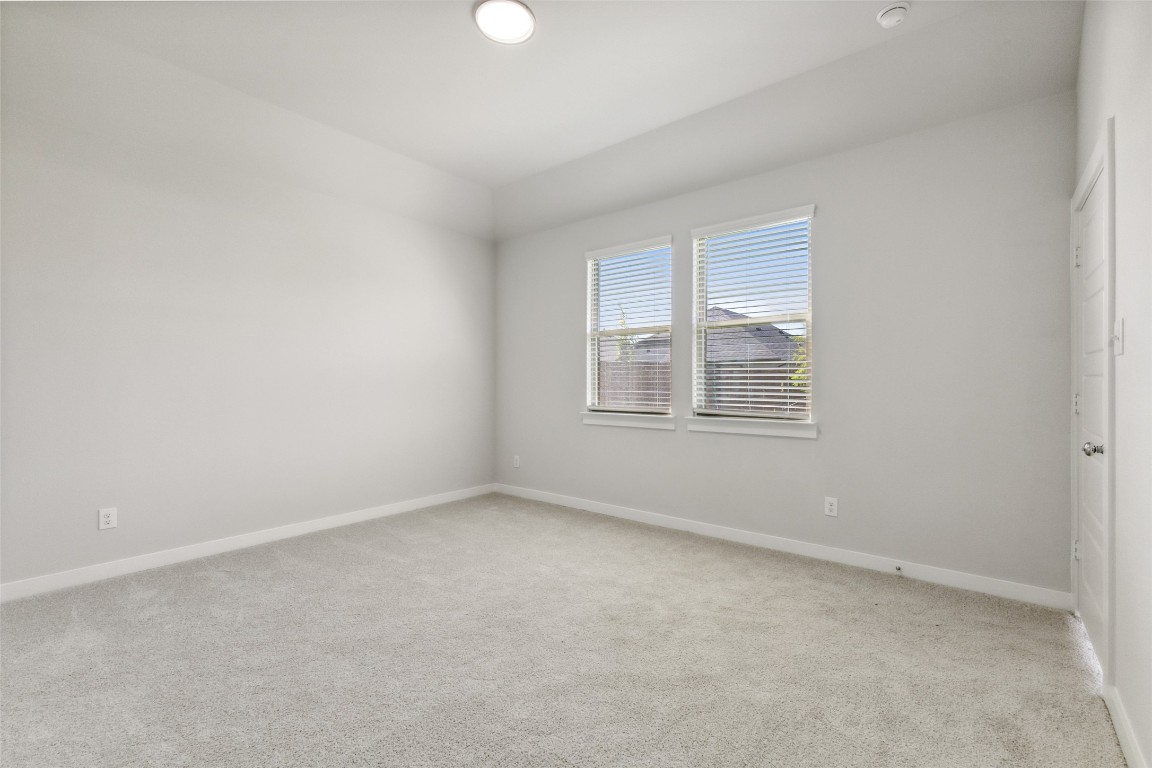 153 Tolo Drive Elgin, TX 78621 - Photo 10 of 25 an empty room with windows