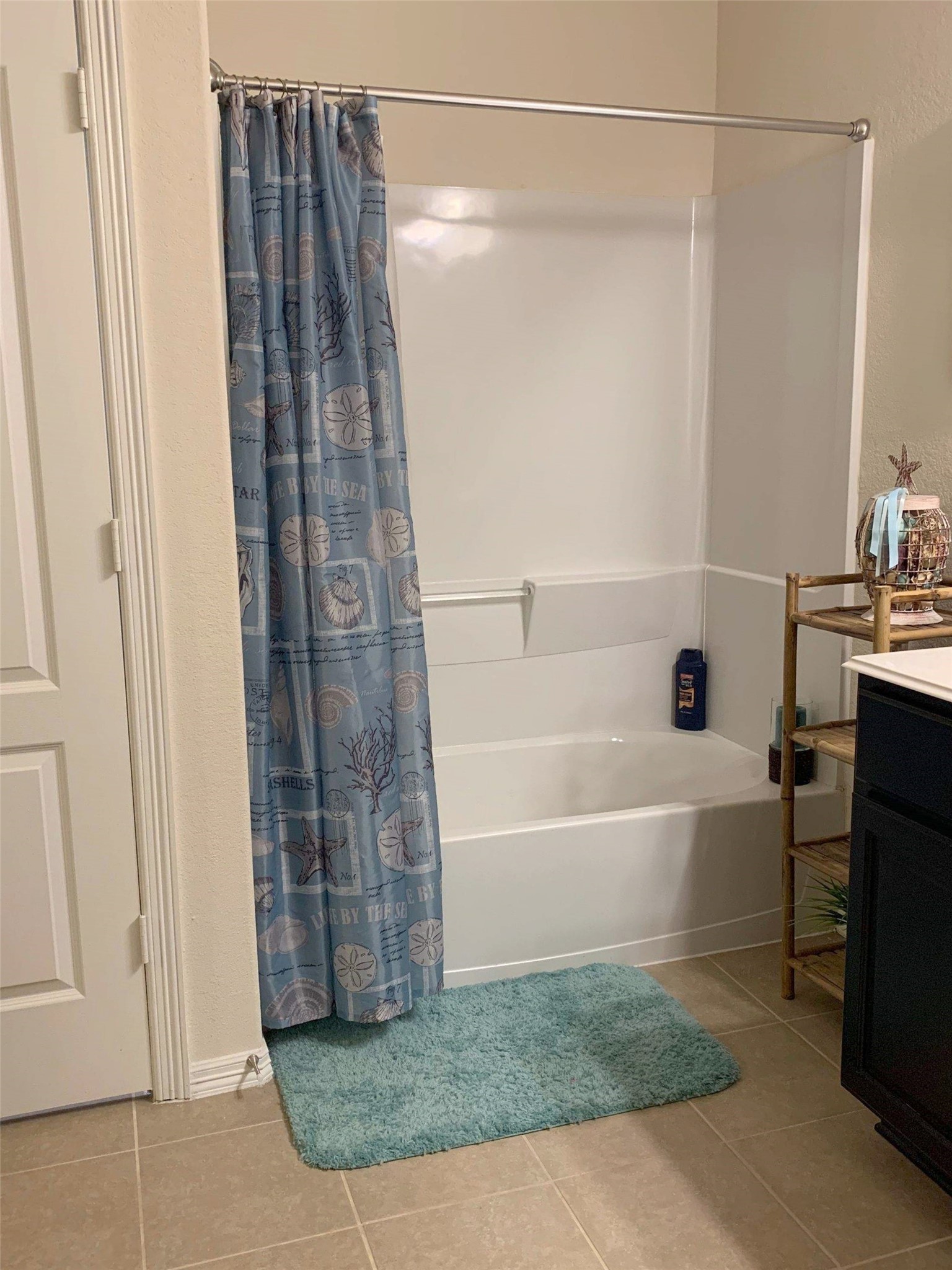 9931 Swindale Ridge Lane Houston, TX 77044 - Photo 12 of 29 a bathroom with a bathtub and a shower