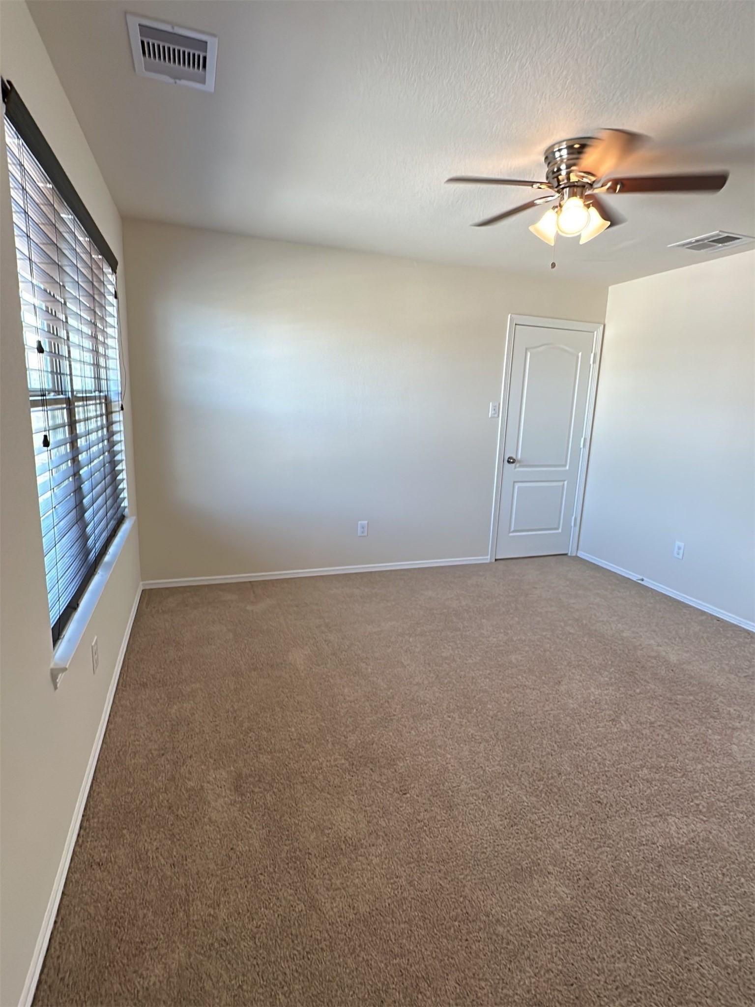 9931 Swindale Ridge Lane Houston, TX 77044 - Photo 23 of 29 a view of an empty room with a window