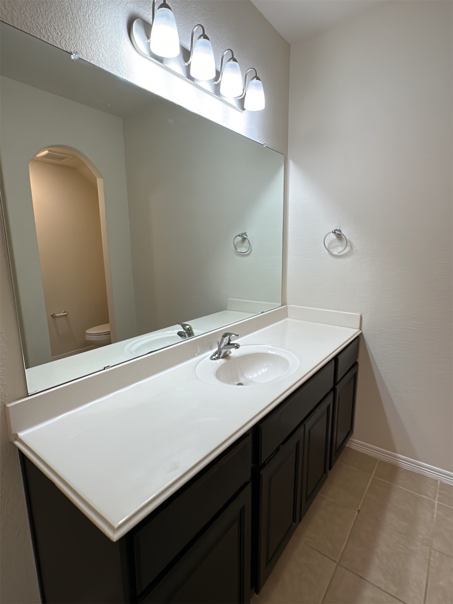 9931 Swindale Ridge Lane Houston, TX 77044 - Photo 25 of 29 a bathroom with a sink and a mirror