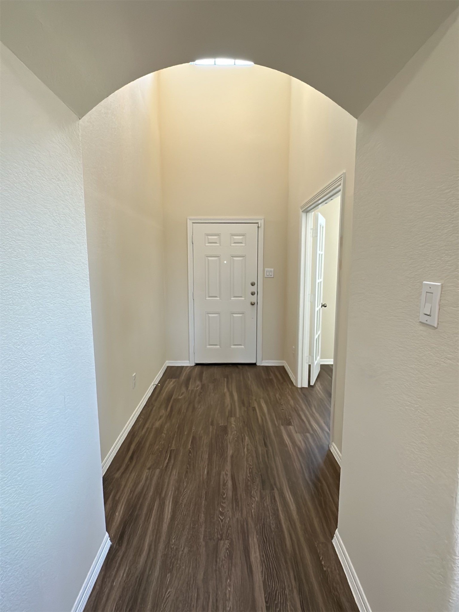 9931 Swindale Ridge Lane Houston, TX 77044 - Photo 3 of 29 a view of a hallway with wooden floor