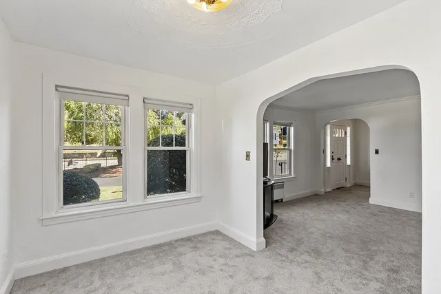 an empty room that has a window