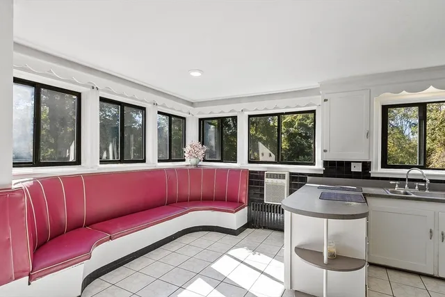 a kitchen with stainless steel appliances cabinets and window