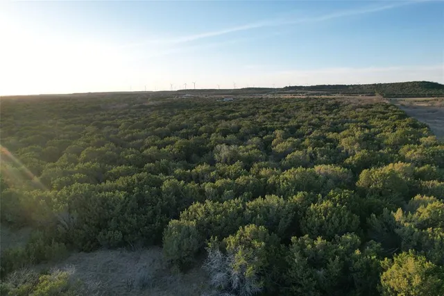 an aerial view of houses with yard