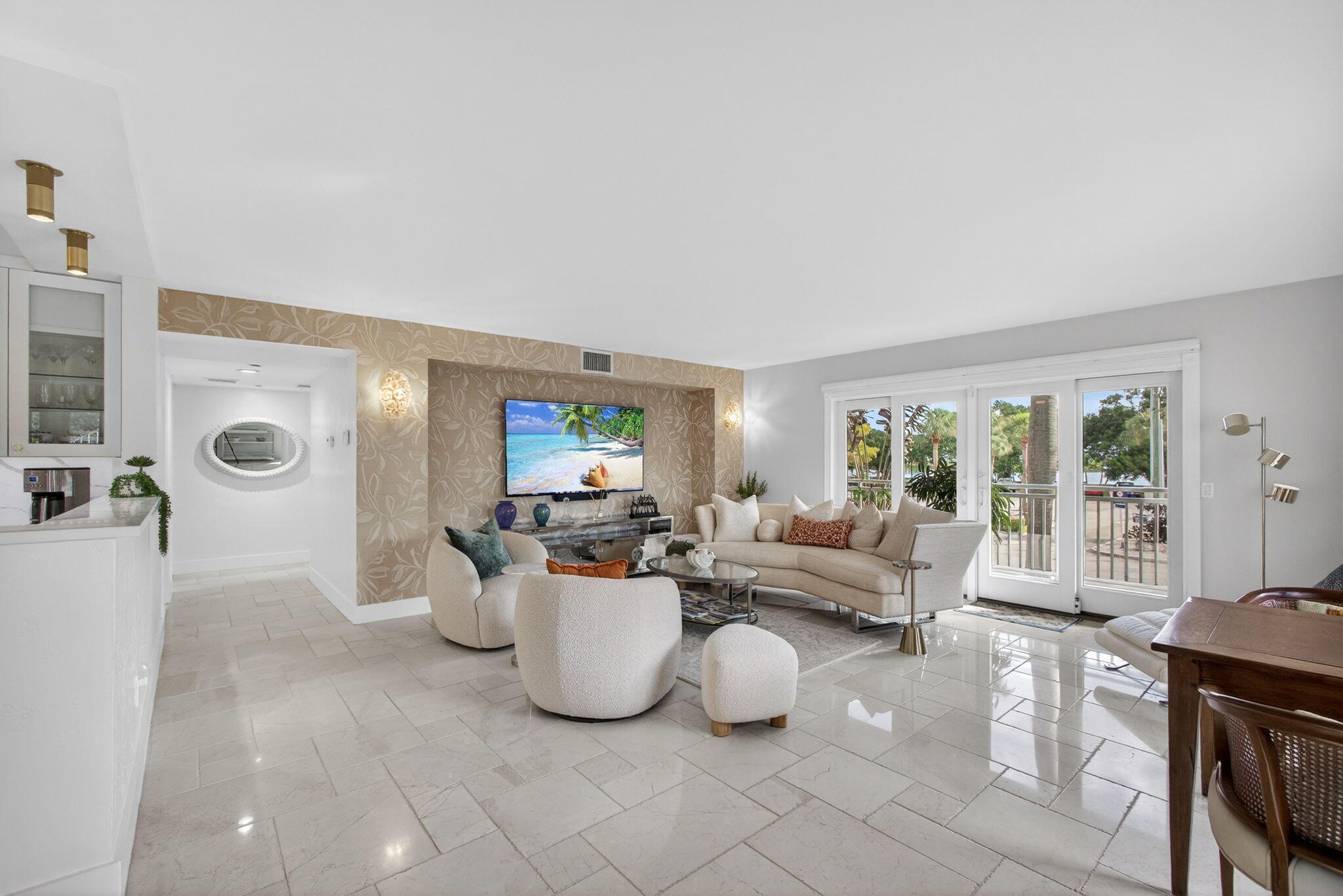 129 South Golfview Road, Unit 6 Lake Worth Beach, FL 33460 - Photo 12 of 51 a living room with furniture a flat screen tv and a large window