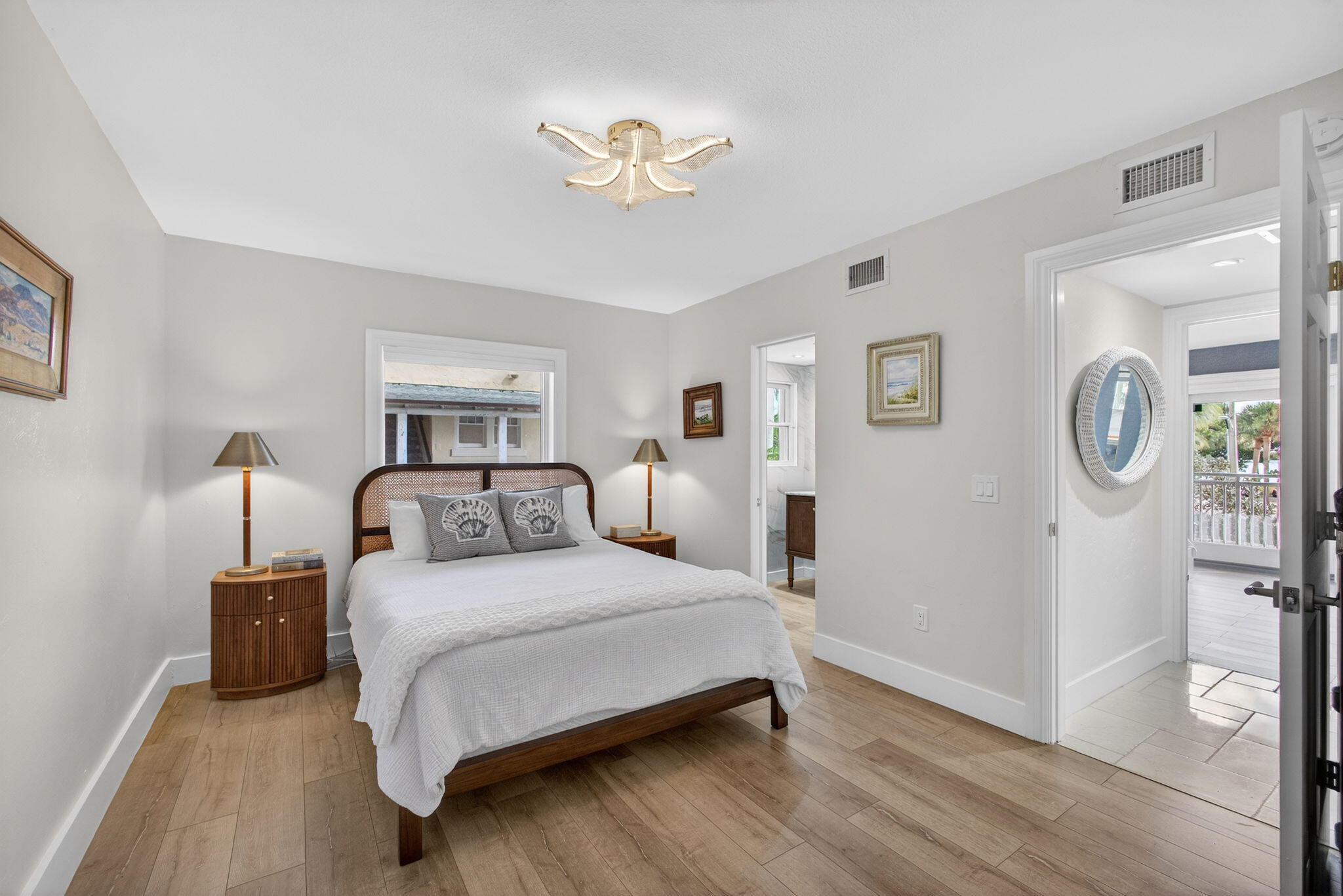 129 South Golfview Road, Unit 6 Lake Worth Beach, FL 33460 - Photo 20 of 51 a bedroom with a bed lamp and a window