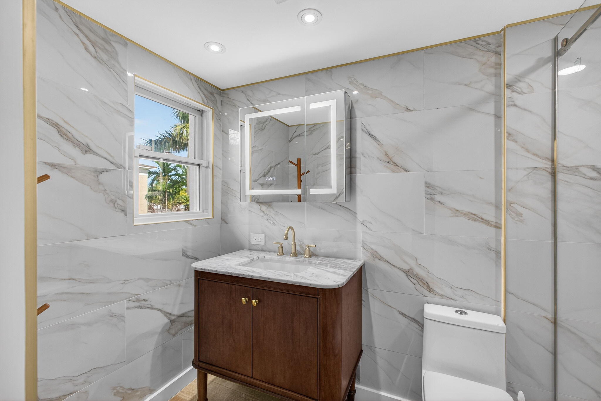 129 South Golfview Road, Unit 6 Lake Worth Beach, FL 33460 - Photo 21 of 51 a bathroom with a double vanity sink and a mirror