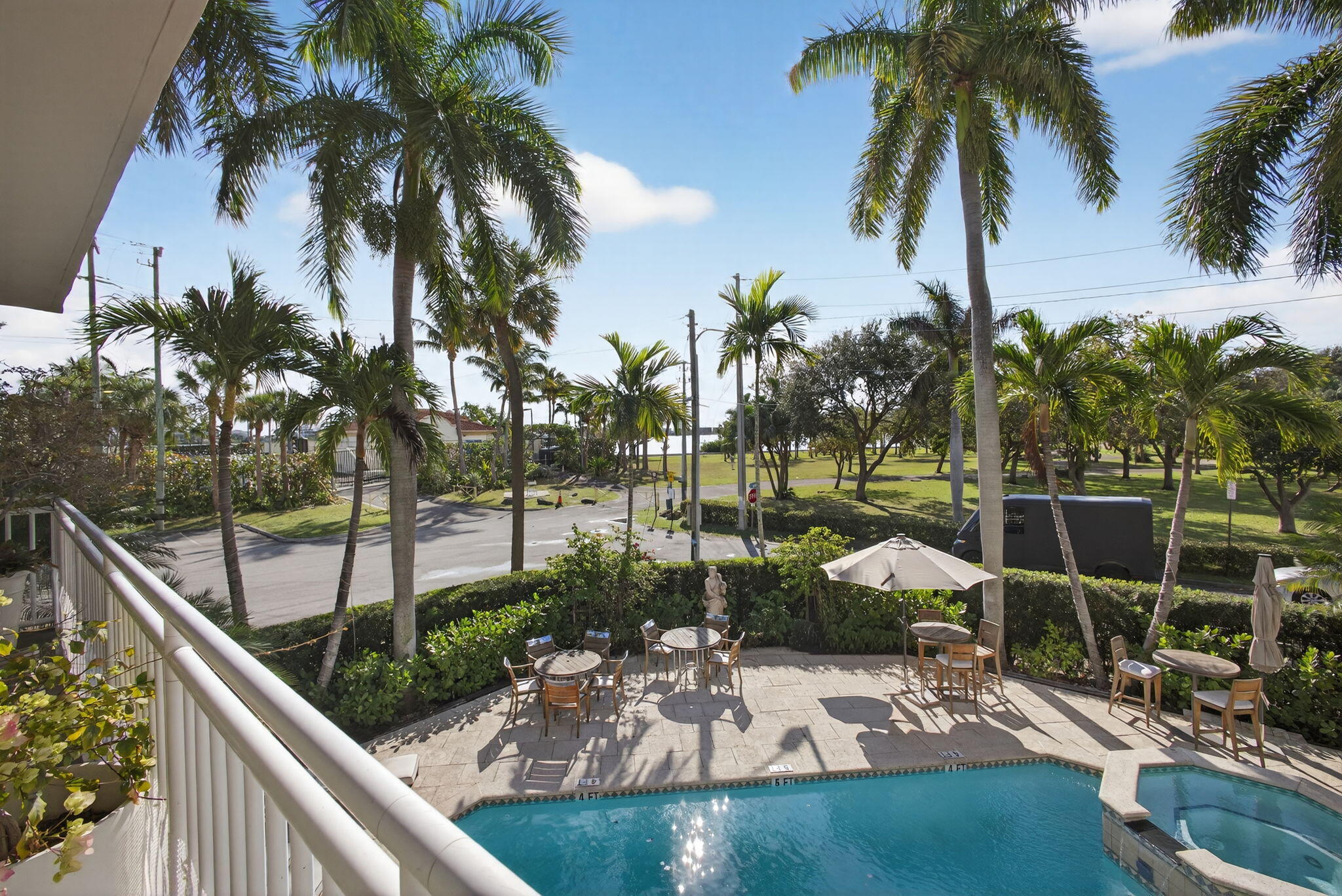 129 South Golfview Road, Unit 6 Lake Worth Beach, FL 33460 - Photo 29 of 51 a view of a swimming pool with a patio and a garden