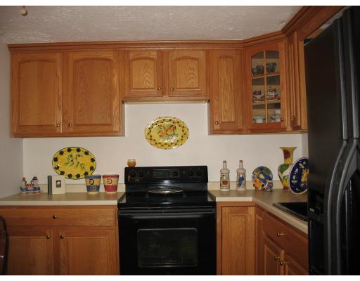 135 Winchester Road Arlington, MA 02474 - Photo 5 of 12 a kitchen with a sink a stove and cabinets