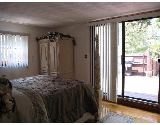 135 Winchester Road Arlington, MA 02474 - Photo 7 of 12 a bedroom with a bed and a window