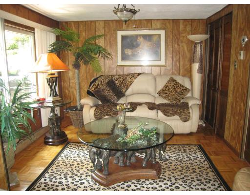 135 Winchester Road Arlington, MA 02474 - Photo 8 of 12 a living room with a couch and a table