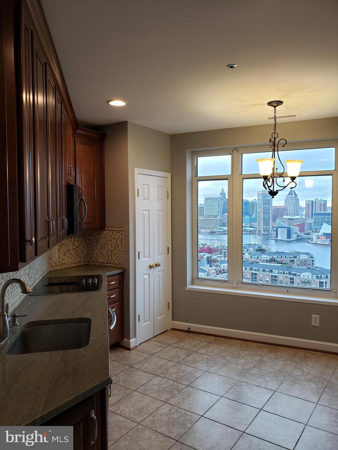 100 Harborview Drive, Unit 2103 Baltimore, MD 21230 - Photo 4 of 40 Kitchen cabinets, cherry