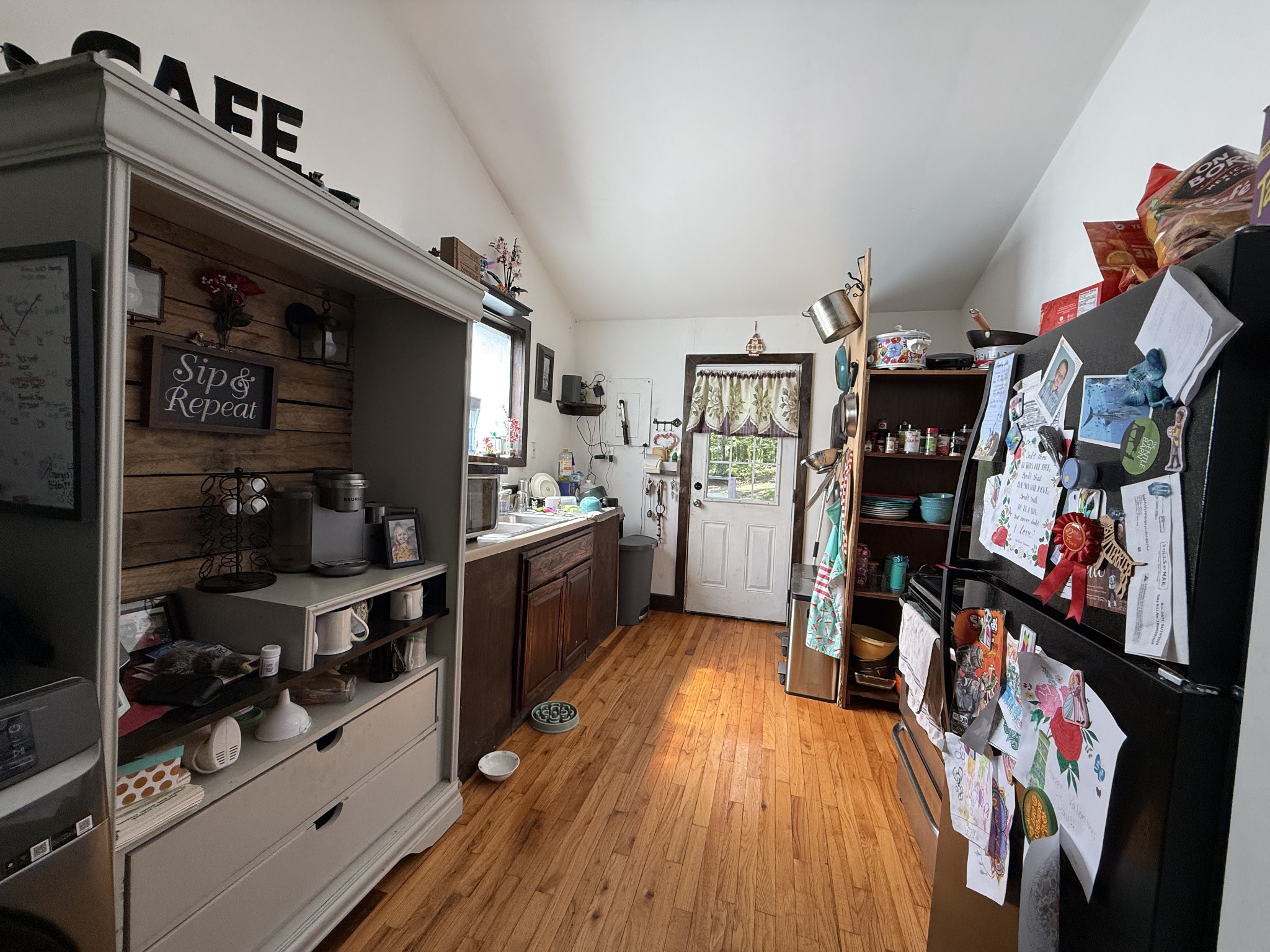 180 Webb Road Summertown, TN 38483 - Photo 7 of 25 a view of a kitchen with fridge and workspace