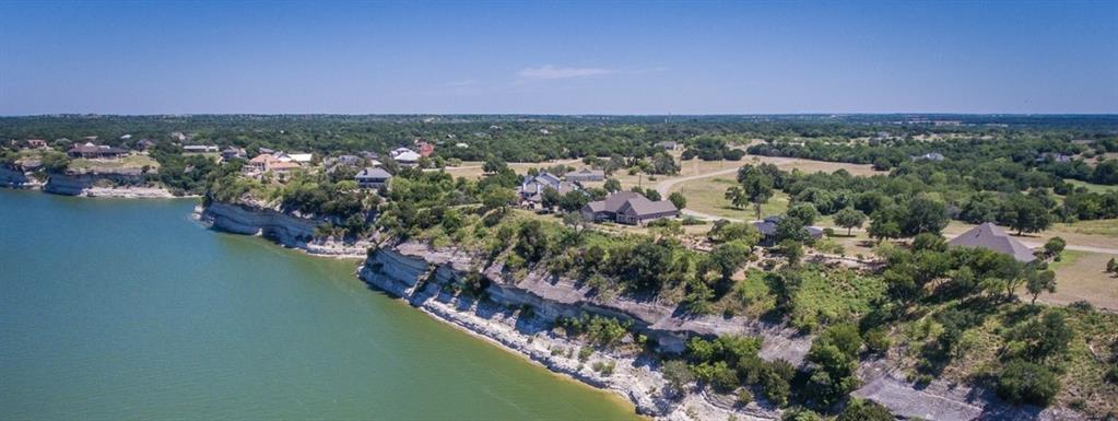 44028 Fringewood Drive Whitney, TX 76692 - Photo 2 of 4 an aerial view of city and lake