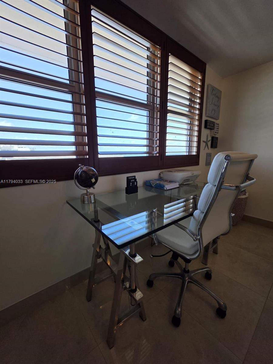 9225 Collins Avenue, Unit 1409 Surfside, FL 33154 - Photo 19 of 41 a view of a workspace with a window