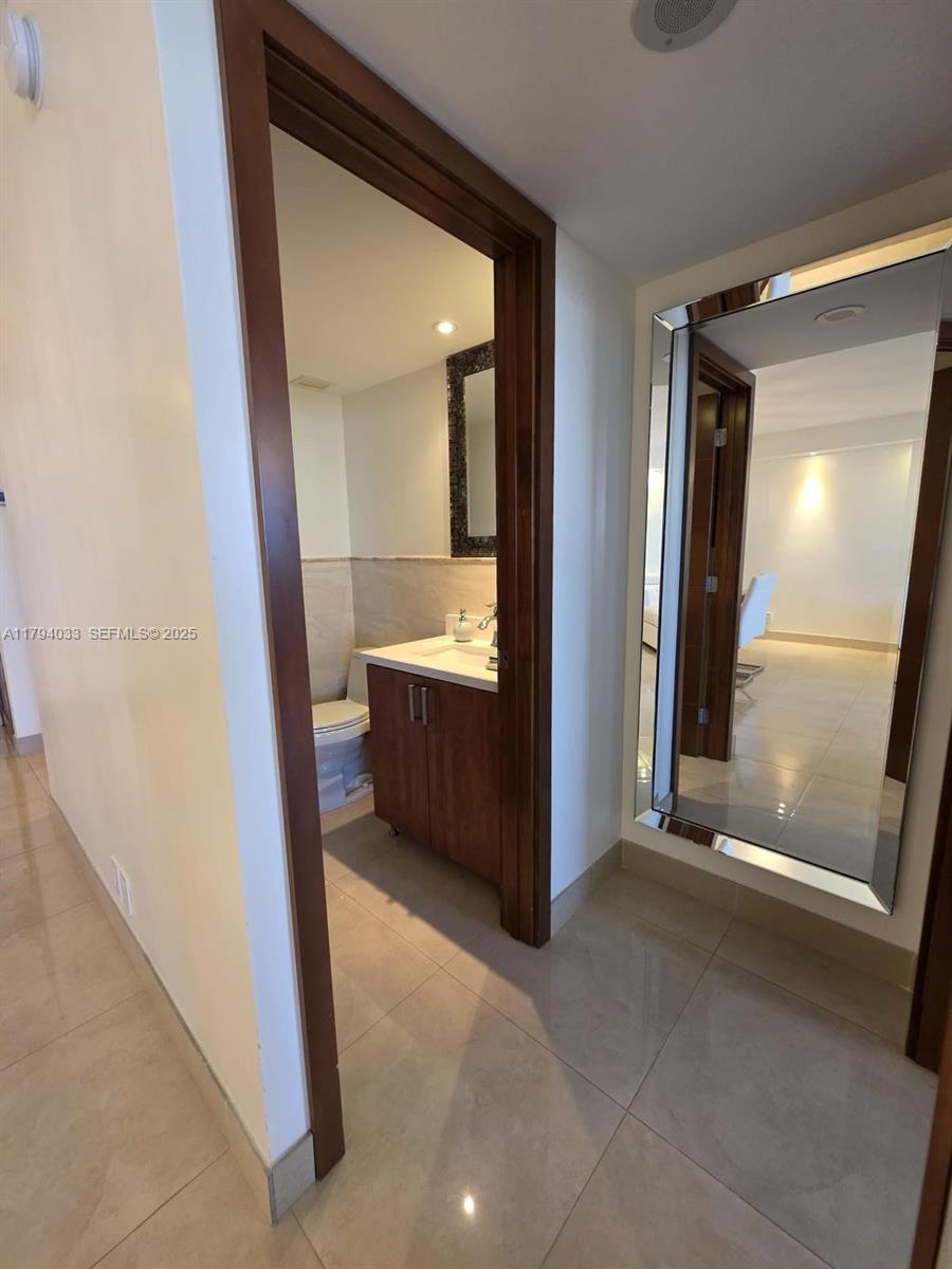 9225 Collins Avenue, Unit 1409 Surfside, FL 33154 - Photo 24 of 41 a view of a room with front door