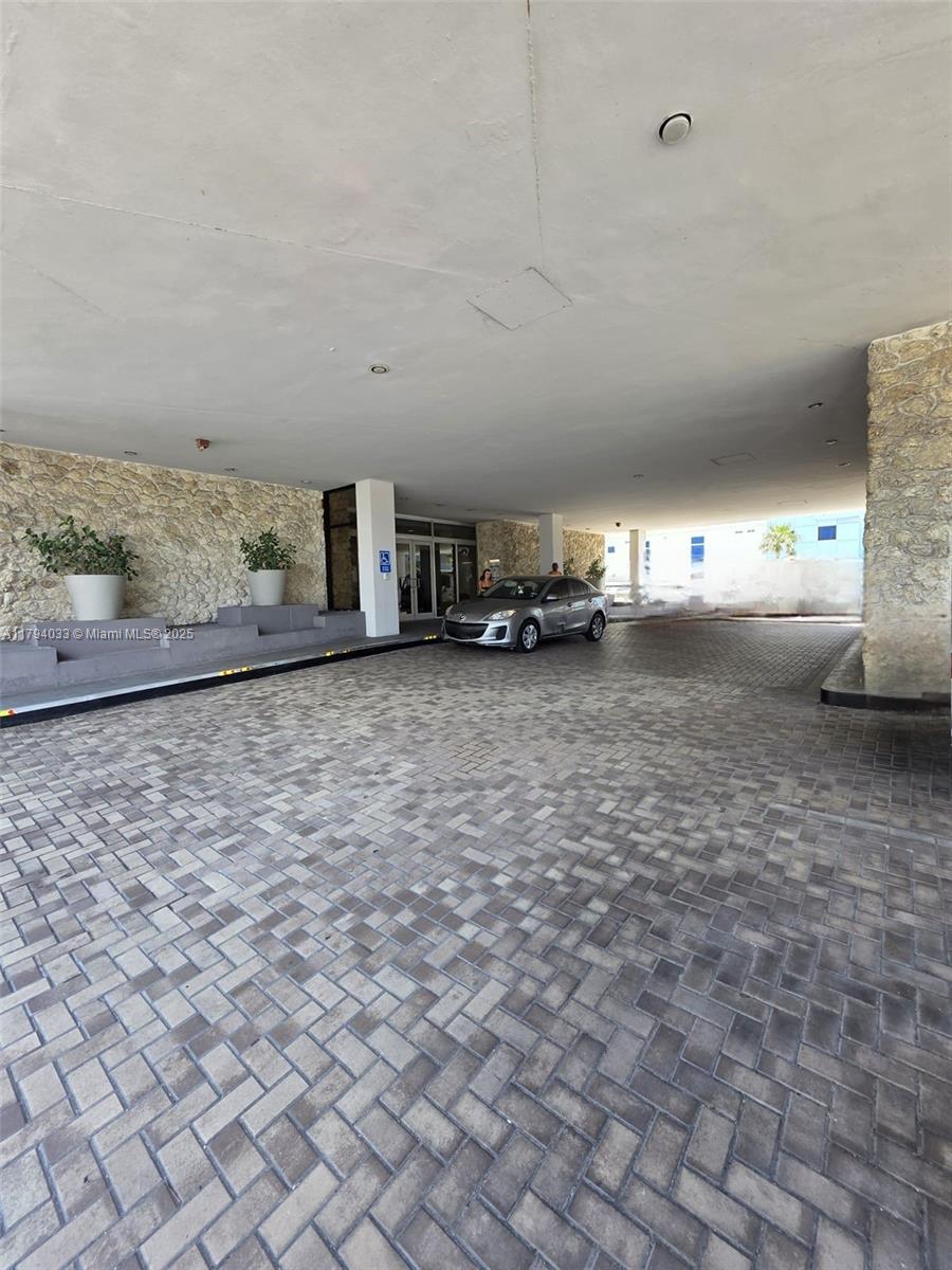 9225 Collins Avenue, Unit 1409 Surfside, FL 33154 - Photo 41 of 41 a view of a parking area