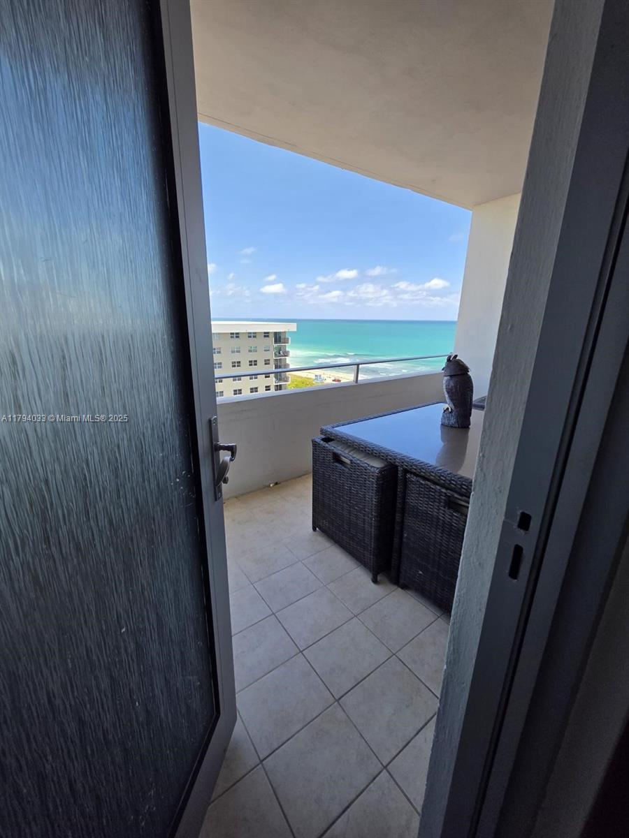 9225 Collins Avenue, Unit 1409 Surfside, FL 33154 - Photo 10 of 41 a view of a kitchen with a sink