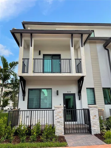 a front view of a house with balcony