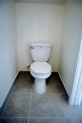 a bathroom with a toilet and a sink