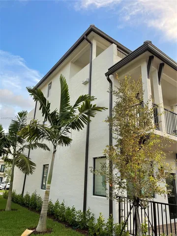 a view of a house with a small yard