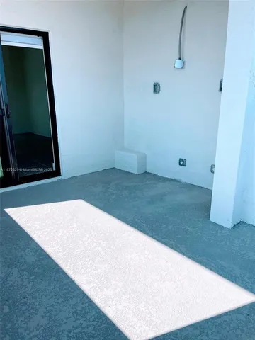 a view of a livingroom with furniture and a flat screen tv