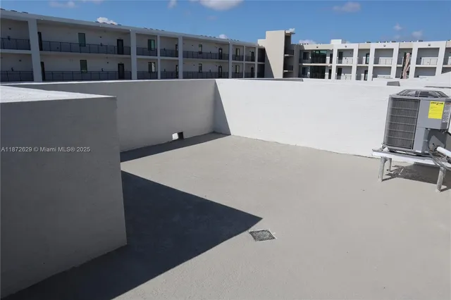 a view of a terrace with sitting area