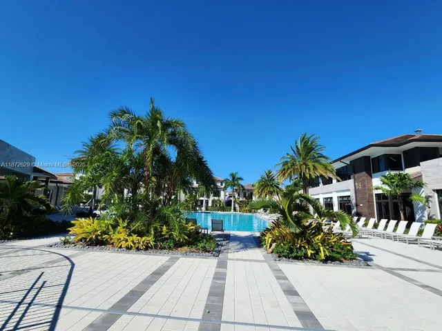 a living room with lots of furniture and a view of chandelier