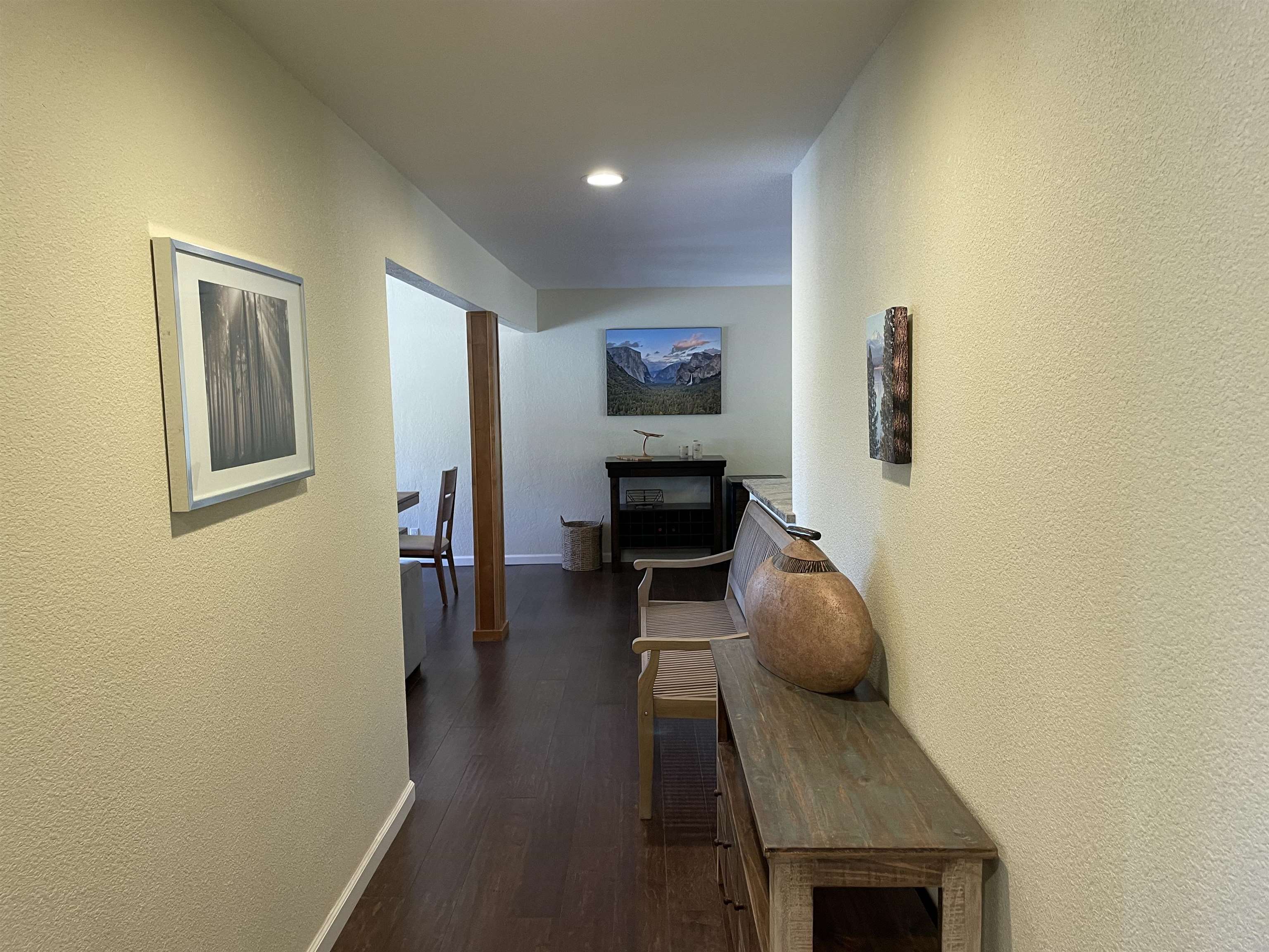 831 Timber Ridge Road Lake Almanor, CA 96137 - Photo 6 of 36 a living room with furniture and a wooden floor