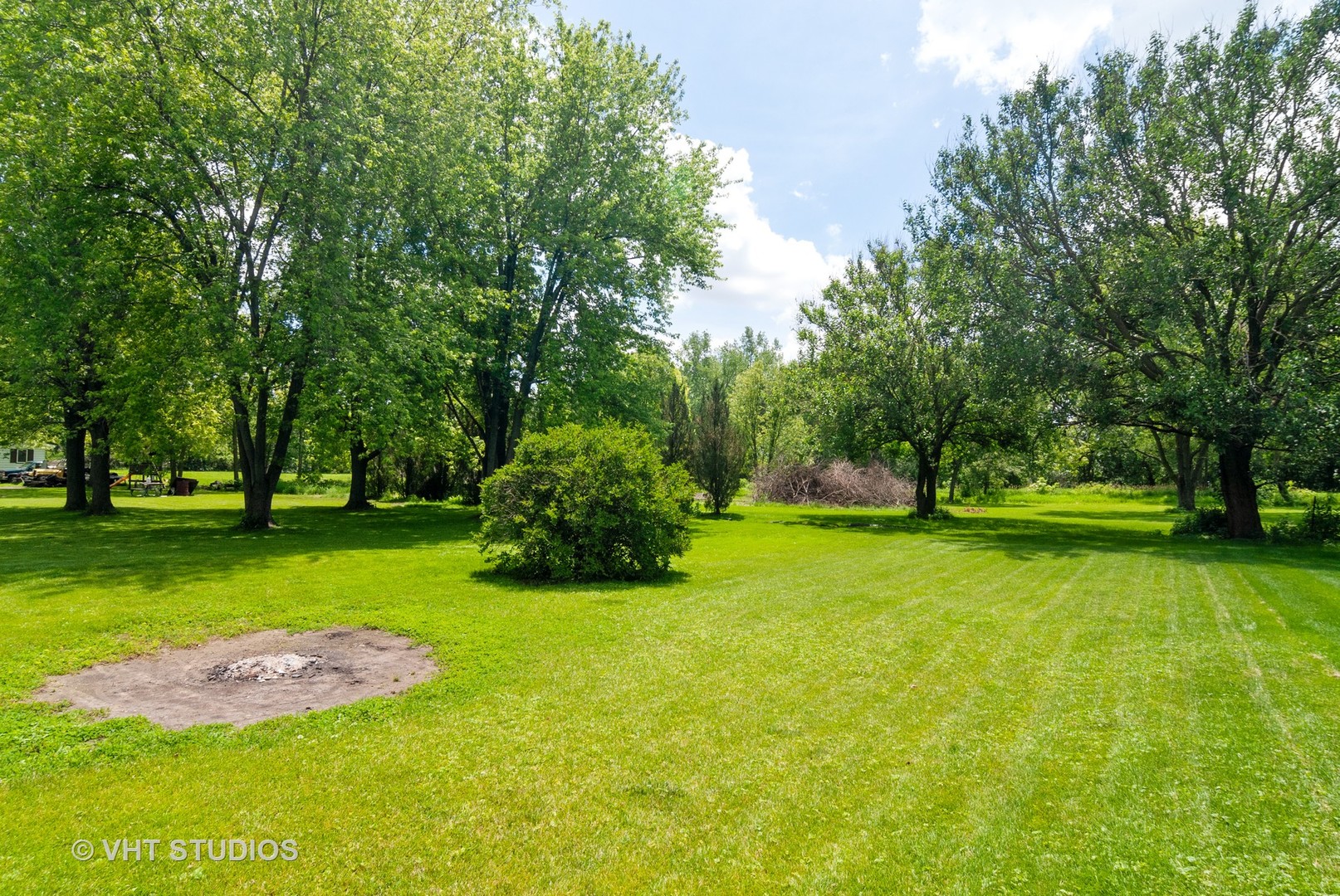 4740 Mill Road Oswego, IL 60543 - Photo 12 of 13 a garden view with a fountain