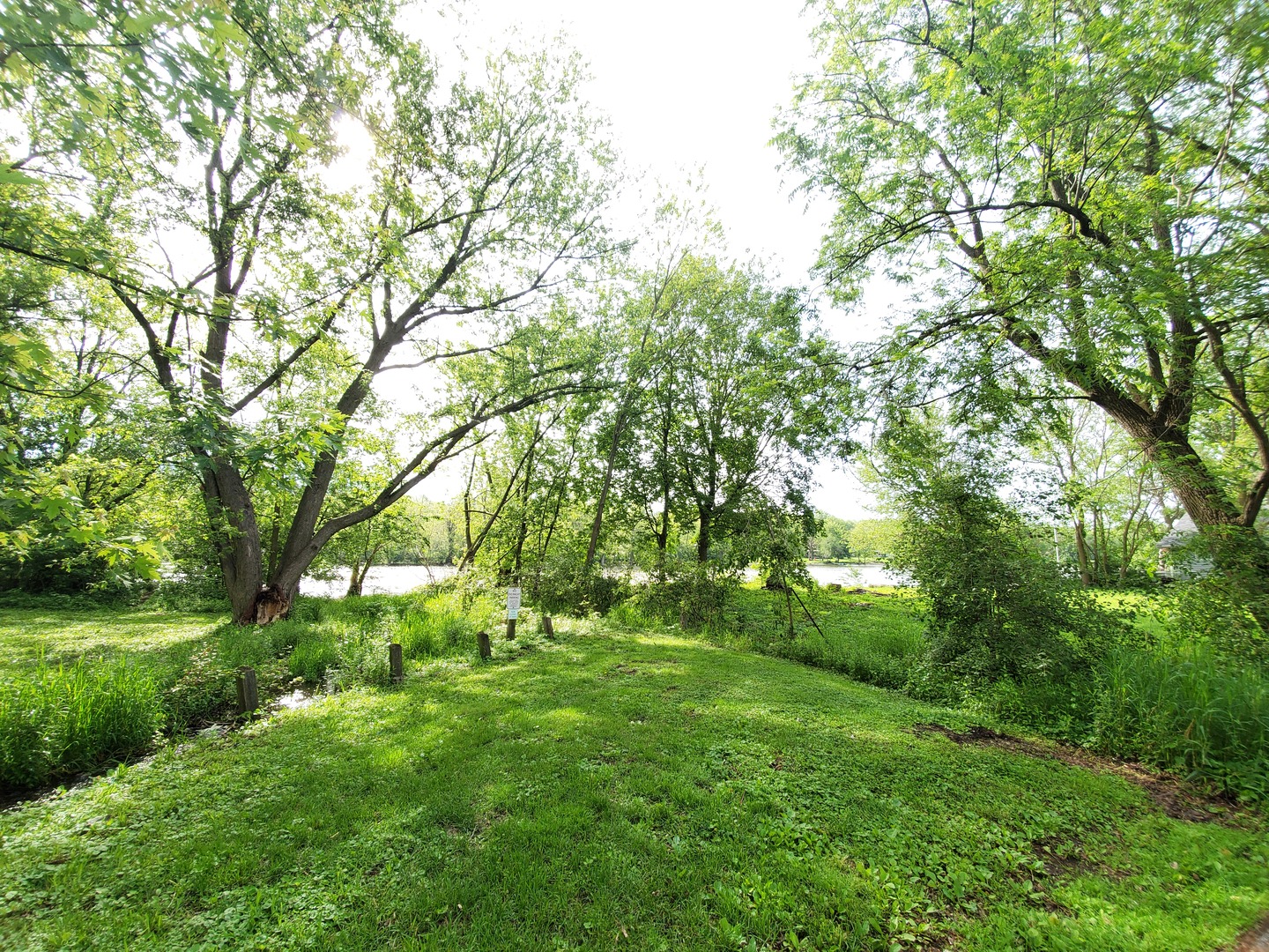 4740 Mill Road Oswego, IL 60543 - Photo 13 of 13 a backyard of a house with lots of green space