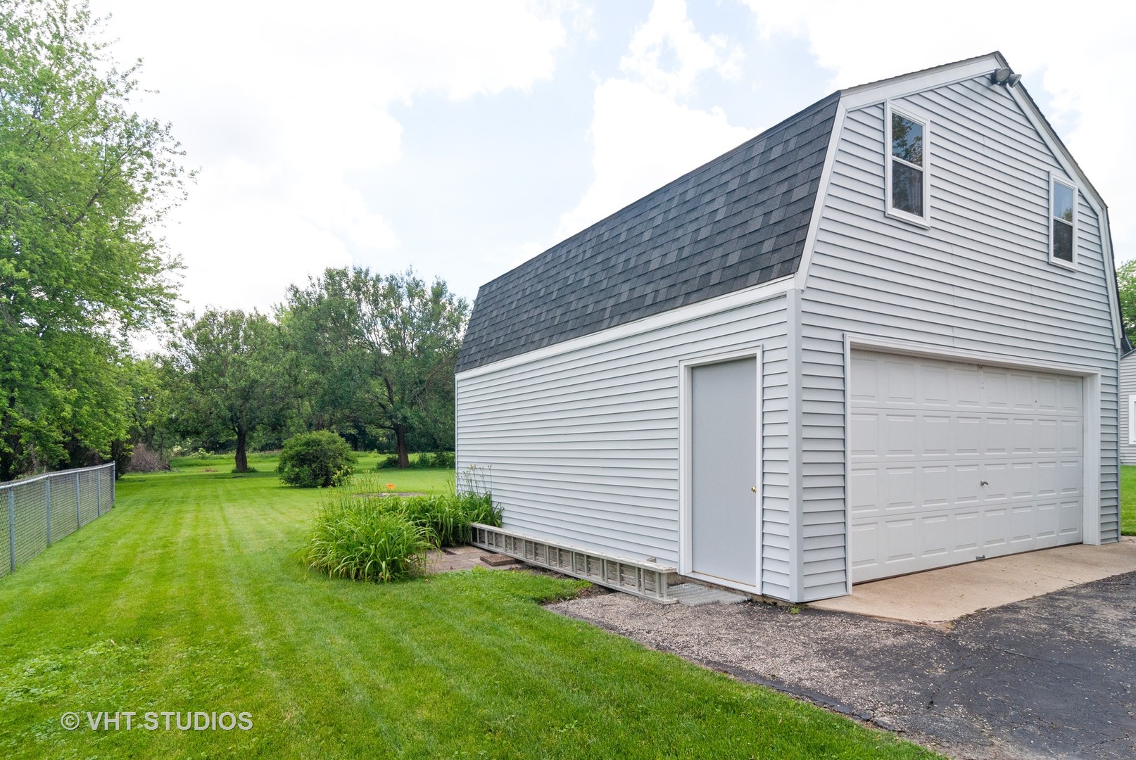 4740 Mill Road Oswego, IL 60543 - Photo 10 of 13 a view of a white house next to a yard