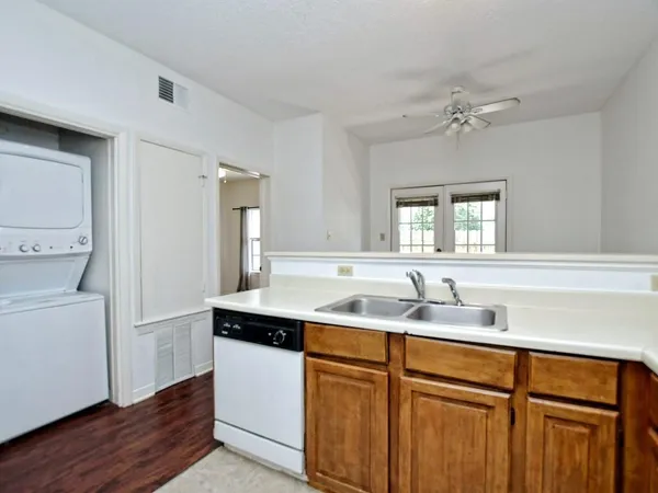 a kitchen with a sink and cabinets
