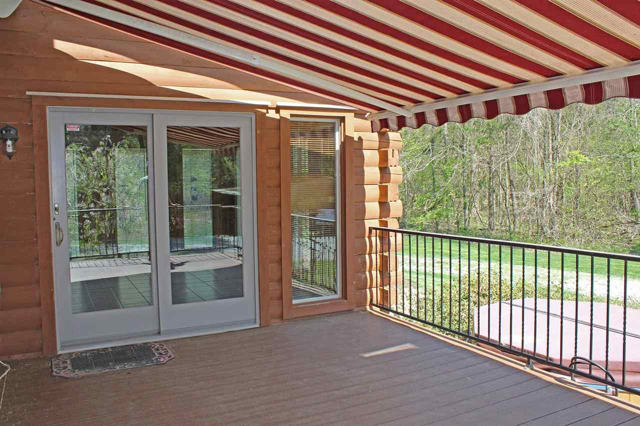 5214 Gray Road Timberlake, NC 27583 - Photo 8 of 30 deck with awning