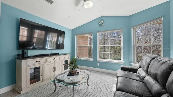 a living room with furniture and a large window