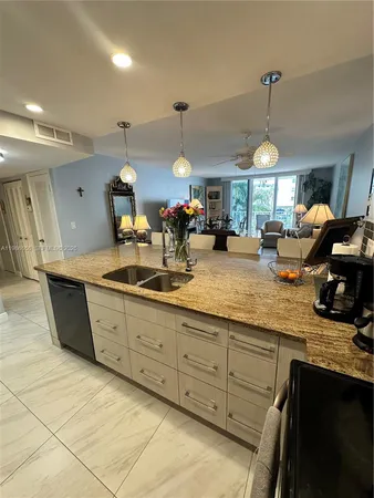 a kitchen with counter top space appliances and cabinets