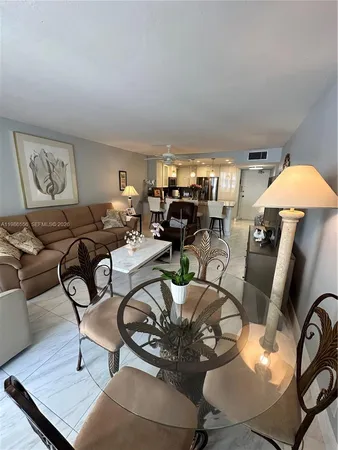 a room with furniture a rug and a window